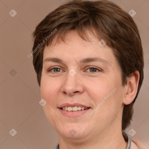 Joyful white adult female with short  brown hair and grey eyes