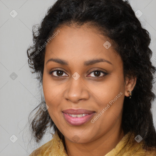 Joyful black young-adult female with long  brown hair and brown eyes