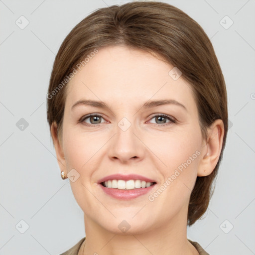 Joyful white young-adult female with medium  brown hair and grey eyes