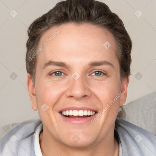 Joyful white adult male with short  brown hair and grey eyes