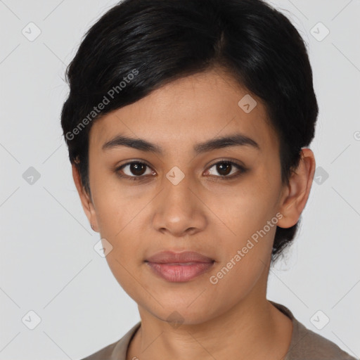 Joyful latino young-adult female with short  black hair and brown eyes