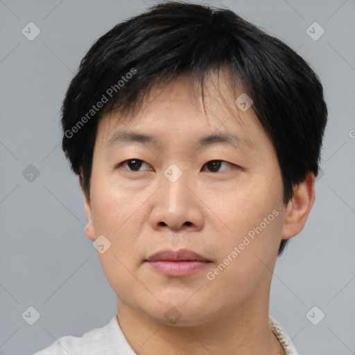 Neutral asian young-adult male with short  brown hair and brown eyes