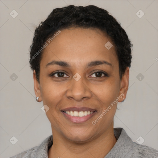 Joyful latino young-adult female with short  black hair and brown eyes