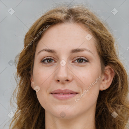 Joyful white young-adult female with long  brown hair and green eyes