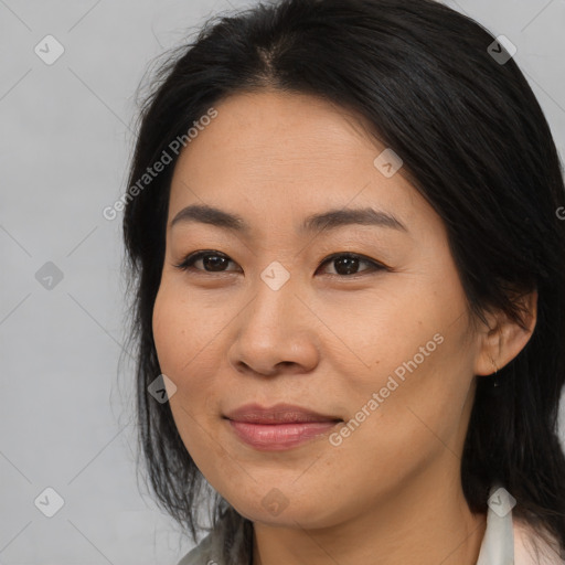 Joyful asian young-adult female with medium  brown hair and brown eyes