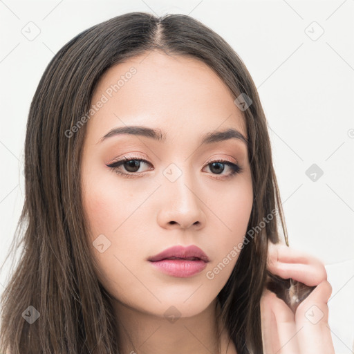 Neutral white young-adult female with long  brown hair and brown eyes