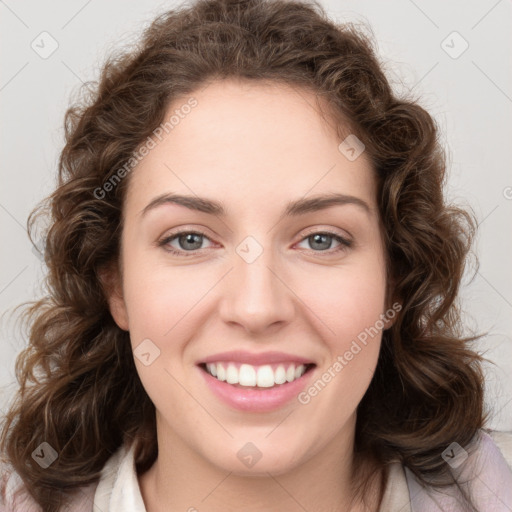 Joyful white young-adult female with medium  brown hair and green eyes