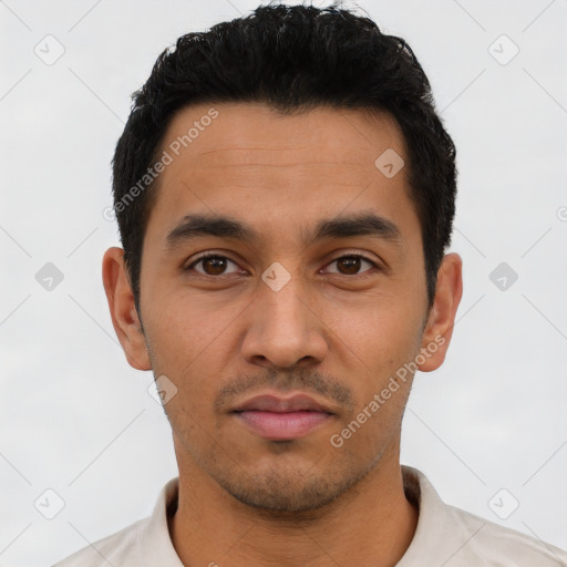 Neutral latino young-adult male with short  black hair and brown eyes