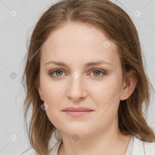 Joyful white young-adult female with medium  brown hair and green eyes