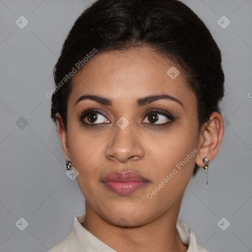 Joyful latino young-adult female with short  brown hair and brown eyes