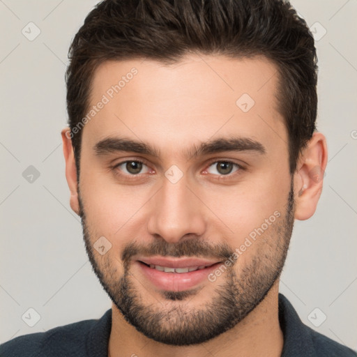 Joyful white young-adult male with short  brown hair and brown eyes