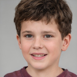 Joyful white child male with short  brown hair and grey eyes