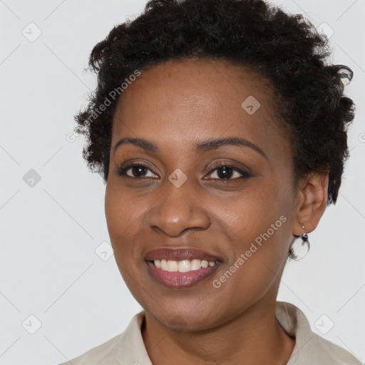 Joyful black young-adult female with short  brown hair and brown eyes