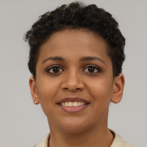 Joyful latino young-adult female with short  brown hair and brown eyes