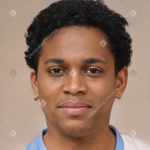 Joyful latino young-adult male with short  brown hair and brown eyes