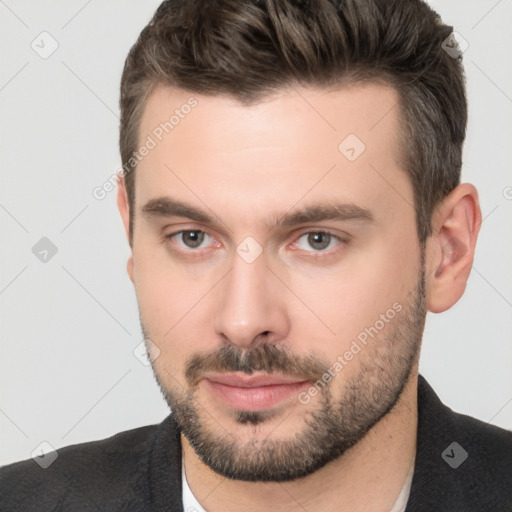 Neutral white young-adult male with short  brown hair and brown eyes