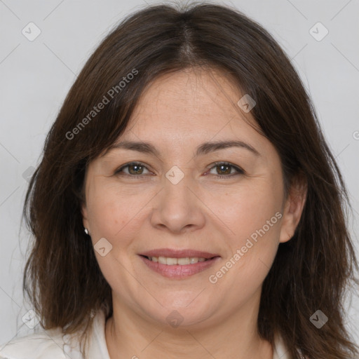 Joyful white adult female with medium  brown hair and brown eyes