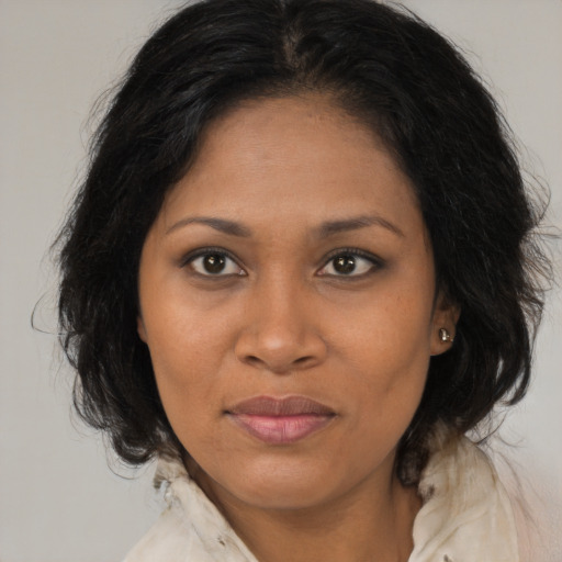 Joyful black young-adult female with medium  brown hair and brown eyes
