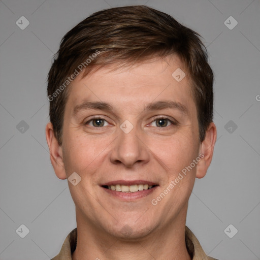 Joyful white adult male with short  brown hair and grey eyes