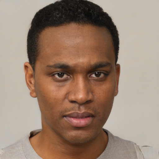 Neutral black young-adult male with short  black hair and brown eyes
