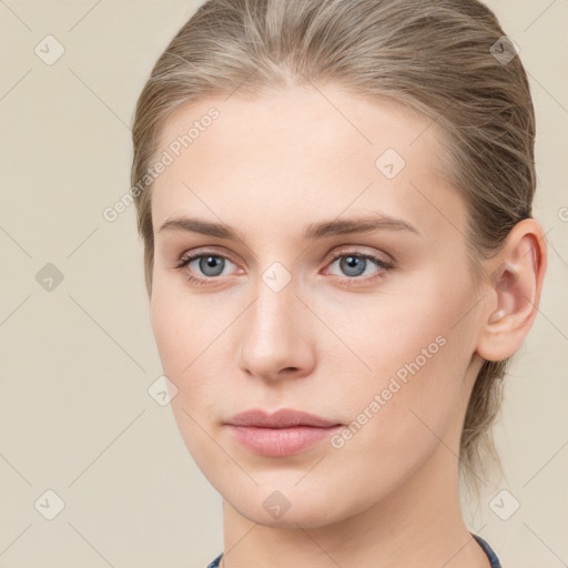 Neutral white young-adult female with medium  brown hair and grey eyes