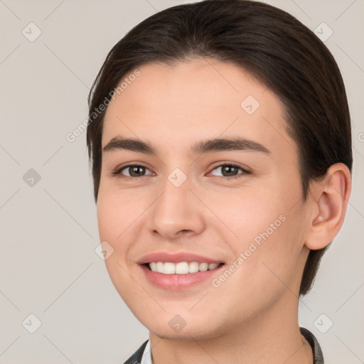 Joyful white young-adult female with short  brown hair and brown eyes