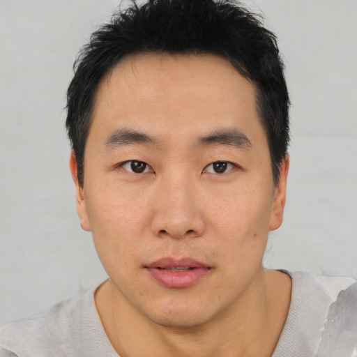 Neutral asian young-adult male with short  black hair and brown eyes