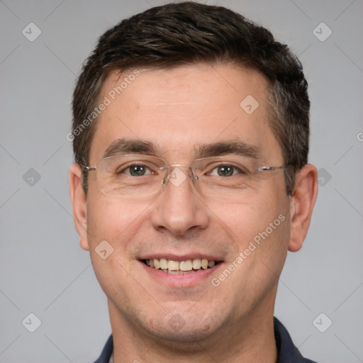 Joyful white adult male with short  brown hair and brown eyes