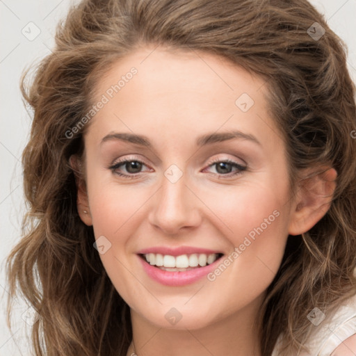 Joyful white young-adult female with medium  brown hair and green eyes