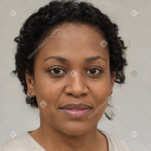 Joyful black adult female with short  brown hair and brown eyes