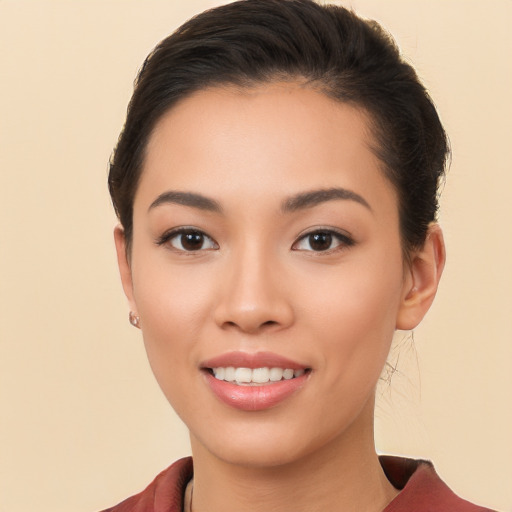 Joyful white young-adult female with long  brown hair and brown eyes