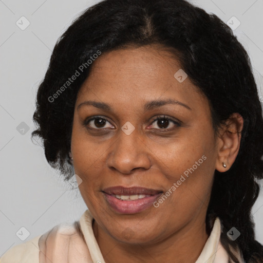 Joyful black adult female with medium  brown hair and brown eyes