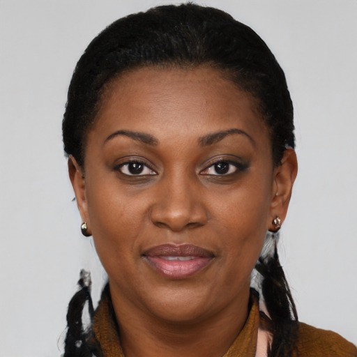 Joyful black adult female with short  black hair and brown eyes