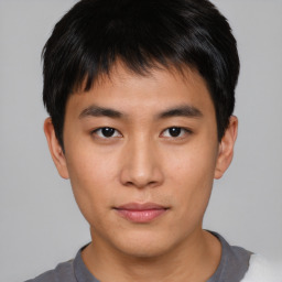 Neutral asian young-adult male with short  brown hair and brown eyes