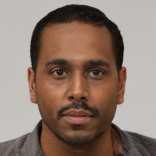 Neutral black young-adult male with short  black hair and brown eyes