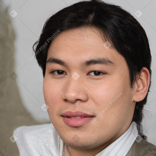 Joyful asian young-adult male with medium  brown hair and brown eyes