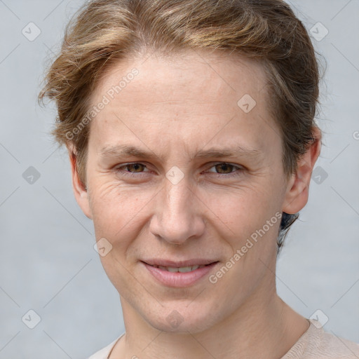 Joyful white adult female with short  brown hair and grey eyes