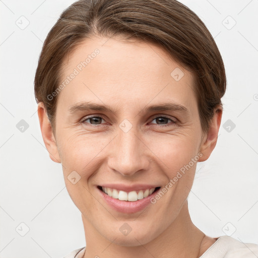 Joyful white young-adult female with short  brown hair and grey eyes