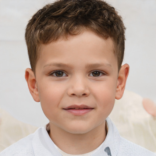 Joyful white child male with short  brown hair and brown eyes