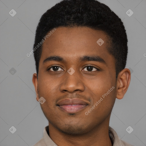 Joyful black young-adult male with short  black hair and brown eyes