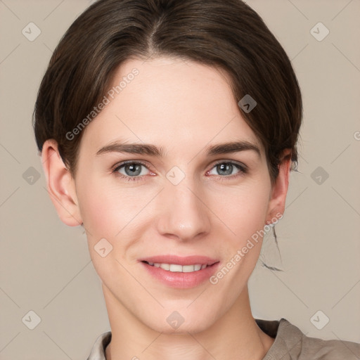 Joyful white young-adult female with short  brown hair and grey eyes