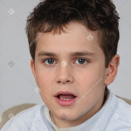 Joyful white child male with short  brown hair and brown eyes