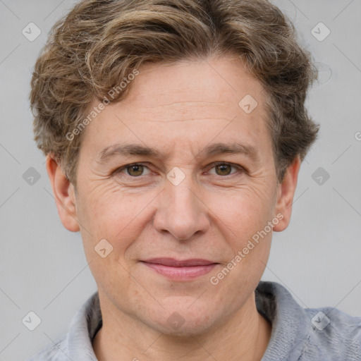 Joyful white adult male with short  brown hair and grey eyes