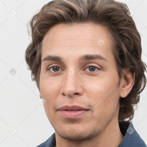 Joyful white young-adult male with medium  brown hair and grey eyes