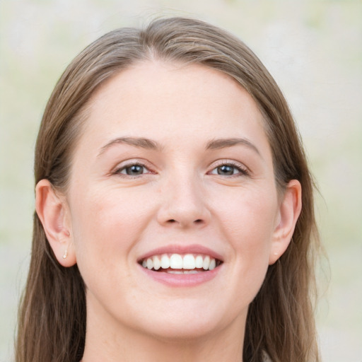 Joyful white young-adult female with medium  brown hair and blue eyes