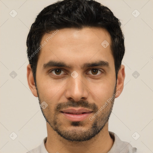 Joyful white young-adult male with short  black hair and brown eyes