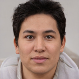 Joyful asian young-adult male with short  brown hair and brown eyes