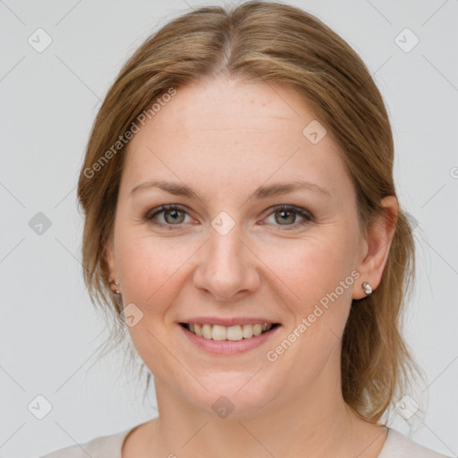 Joyful white young-adult female with medium  brown hair and blue eyes