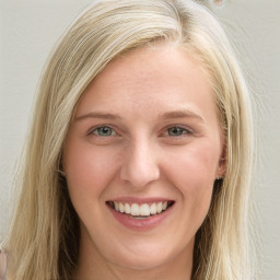 Joyful white young-adult female with long  brown hair and blue eyes