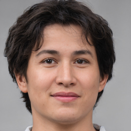 Joyful white young-adult male with medium  brown hair and brown eyes